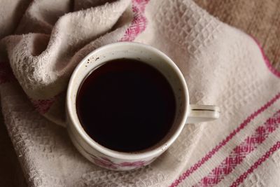 High angle view of coffee cup on table