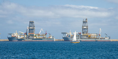 Picture of las palmas canary island port with large ships carrying cargo, large container cranes 