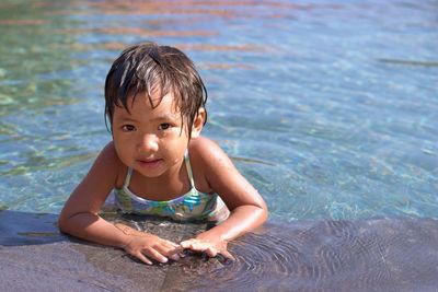 Portrait of cute boy in swimming pool