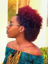 Portrait of beautiful young woman looking away