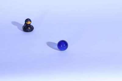 Low angle view of balloons against blue sky