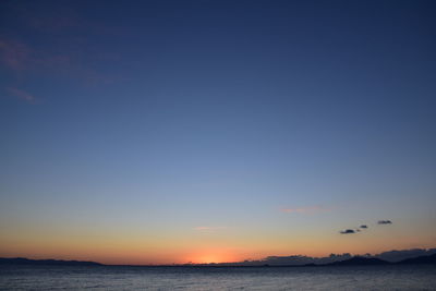 Scenic view of sea against clear sky during sunset