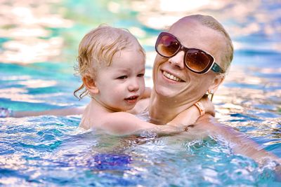 Portrait of woman swimming in pool