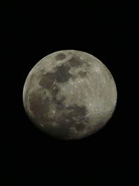 Low angle view of moon against clear sky at night