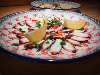 High angle view of fruits in plate on table