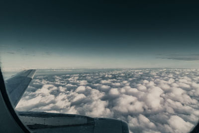 Aerial view of cloudscape seen from airplane window