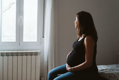 Pregnant woman resting at home