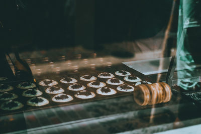 Close-up of sweet food seen through display cabinet