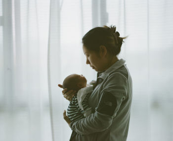 Side view of mother and son