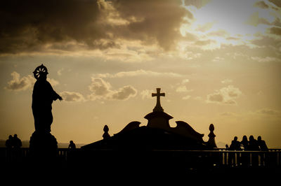 Silhouette church against sky during sunset