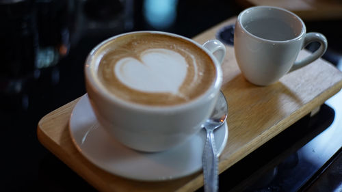 Close-up of cappuccino on table