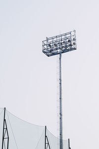 Low angle view of floodlights against clear sky