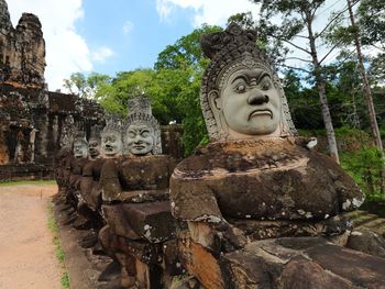 Statue against temple and building