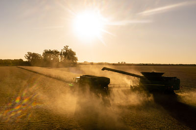 Scenic view of field against sky during sunset