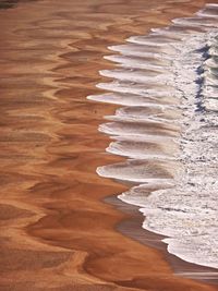 Scenic view of sand at beach