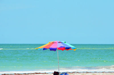 Scenic view of beach against clear sky