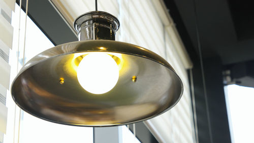 Low angle view of illuminated light bulb