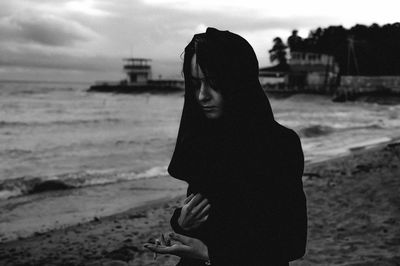 Woman standing at beach