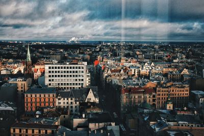 Aerial view of cityscape against sky