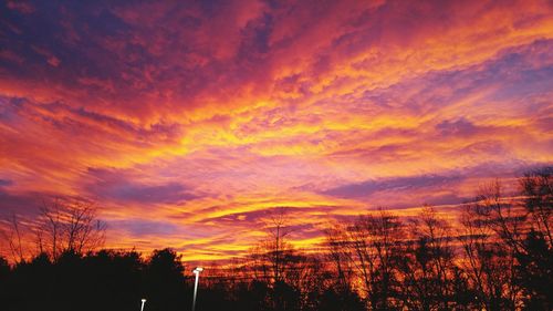 Low angle view of cloudy sky at sunset