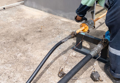 Low section of man working at workshop