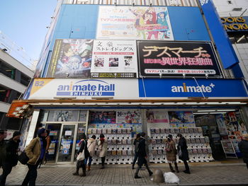 People walking on street in city