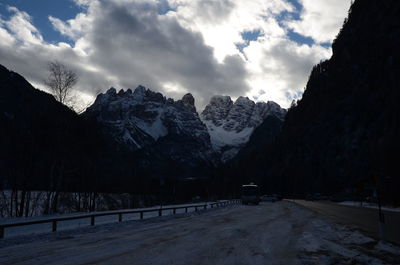 Scenic view of snowcapped mountains against sky during winter