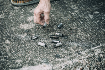 Close-up of hand holding cigarette