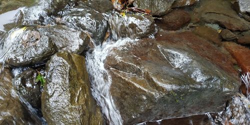 Close-up of water flowing through rocks