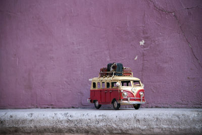 Red toy car on wall