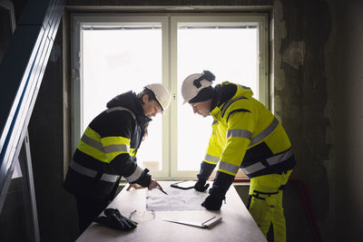 Engineers talking at building site