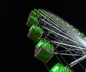 Low angle view of communications tower at night