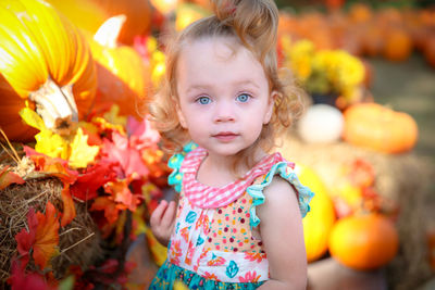 Portrait of cute girl in park during autumn