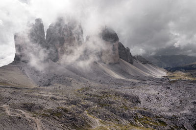 Rocky mountains against clouds