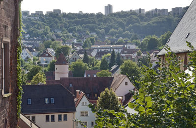 High angle view of townscape and trees in town