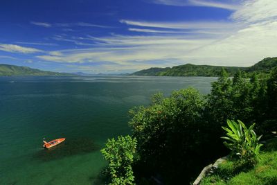 Scenic view of sea against cloudy sky