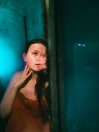 Portrait of woman reflecting in mirror