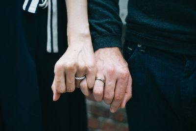 Close-up of cropped hand holding plant