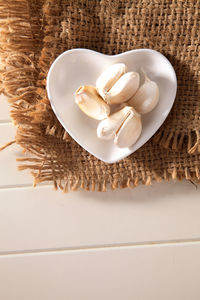 Close-up of garlic on burlap