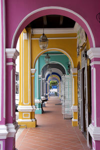 Multi colored arcade at building corridor