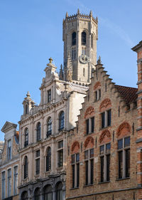 Low angle view of historic building against sky, brugge, belgium