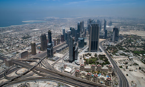 High angle view of modern buildings in city against sky