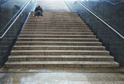 Low angle view of woman walking on stairs