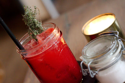 Close-up of drink in glass jar on table