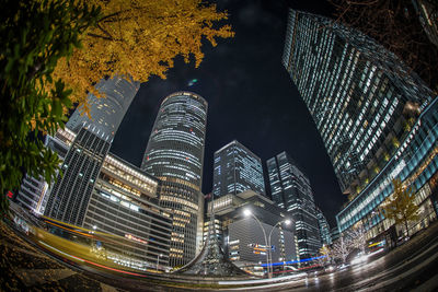 Low angle view of illuminated buildings at night