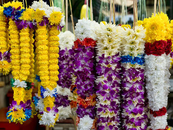 Floral garlands hanging at market stall