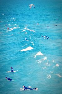 High angle view of people swimming in sea