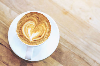 High angle view of cappuccino on table