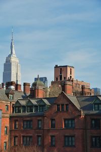 Buildings in city against sky