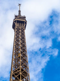 Low angle view of tower against cloudy sky